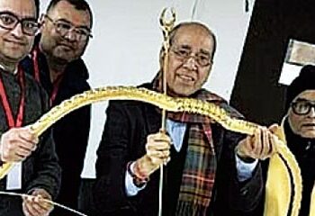 Presented a gold studded bow and arrow